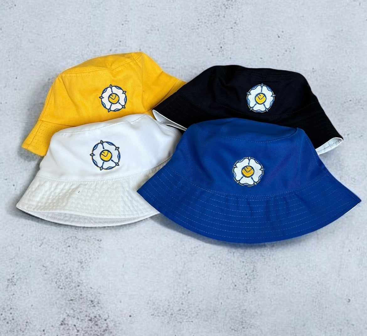 SMILEY ROSE BUCKET HATS